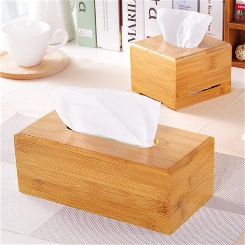 Rectangular and square bamboo tissue boxes displayed on a modern desk