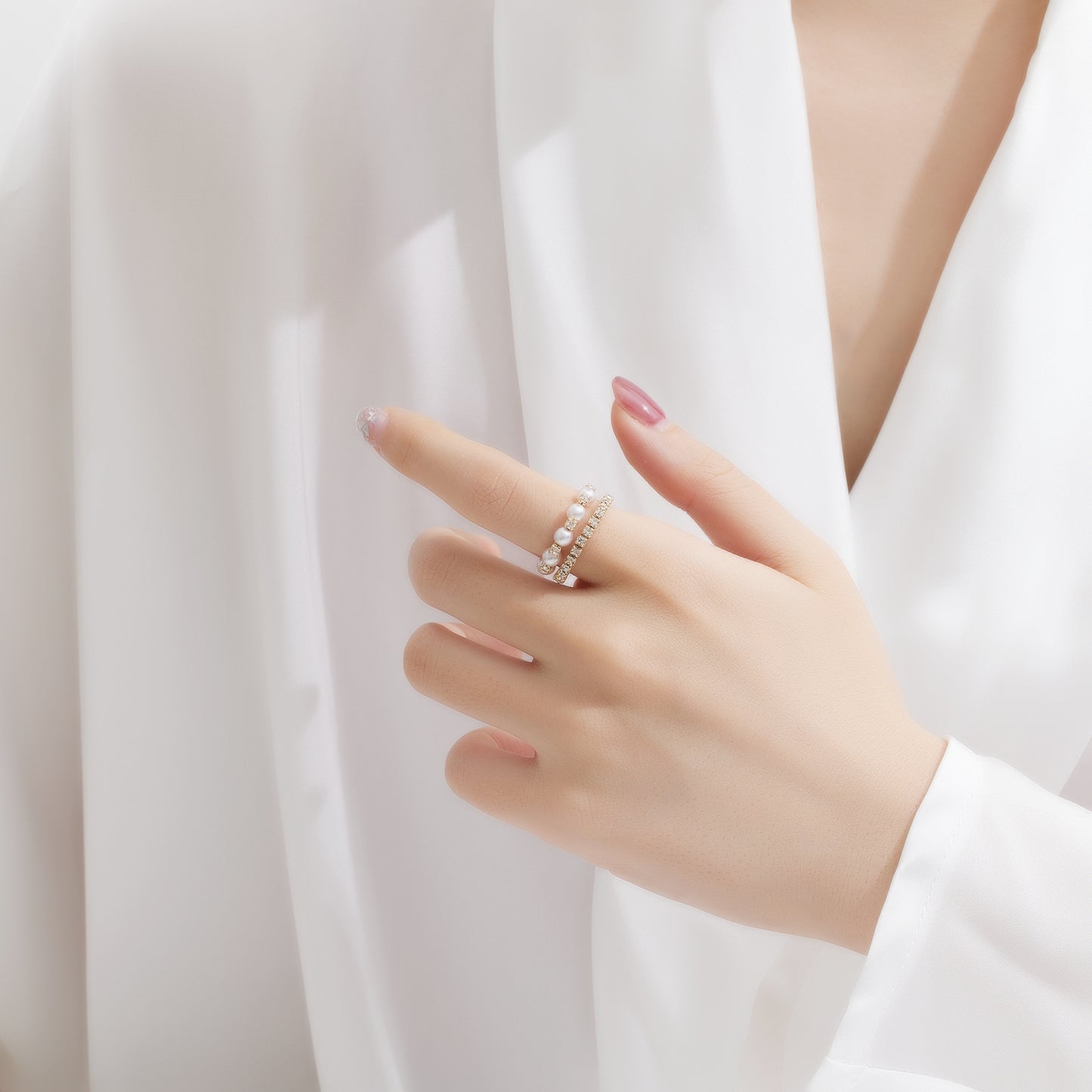 Model wearing Eternal Knot Ring – gold-plated stainless steel interwoven design