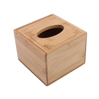 Bamboo tissue box placed in cozy home setting with books and coffee
