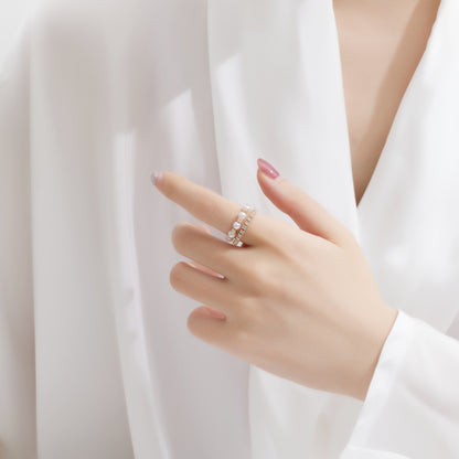 Model wearing Eternal Knot Ring – gold-plated stainless steel interwoven design