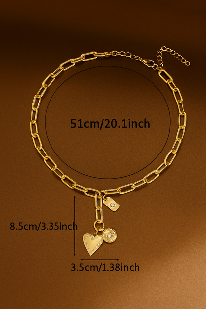 Gold chain bracelet with heart-shaped charm and measurements on a brown background