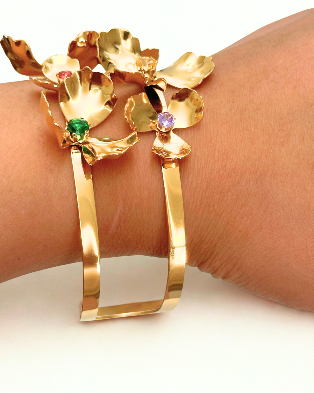 Opulence Bloom cuff bracelet with floral design in stainless steel, PVD gold plating, and colorful gemstone details- side view